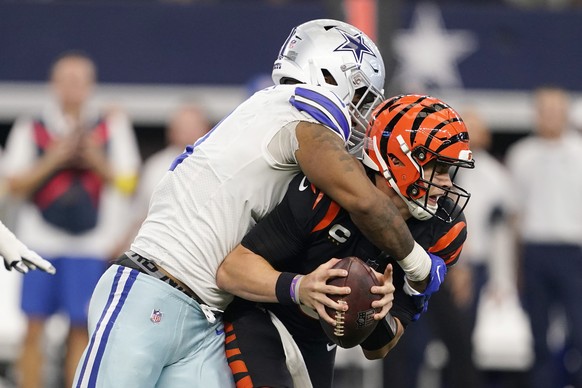 Dallas Cowboys linebacker Micah Parsons (11) sacks Cincinnati Bengals quarterback Joe Burrow (9) during the second half of an NFL football game Sunday, Sept. 18, 2022, in Arlington, Tx. (AP Photo/Tony ...