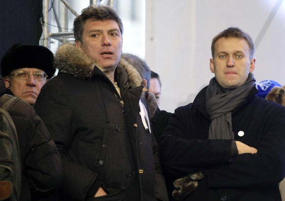 FILE - From left, Russian former Financial Minister Alexei Kudrin, leaders of the opposition Boris Nemtsov and Alexei Navalny attend a rally to protest alleged vote rigging in Russia&#039;s parliament ...