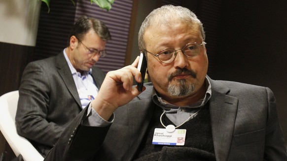 FILE - In this Jan. 29, 2011 file photo, Saudi journalist Jamal Khashoggi speaks on his cellphone at the World Economic Forum in Davos, Switzerland. Eighteen days after Khashoggi disappeared, Saudi Ar ...