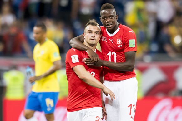 Switzerland&#039;s midfielder Xherdan Shaqiri, left, and Switzerland&#039;s midfielder Denis Zakaria, right, react during the FIFA soccer World Cup 2018 group E match between Switzerland and Brazil at ...