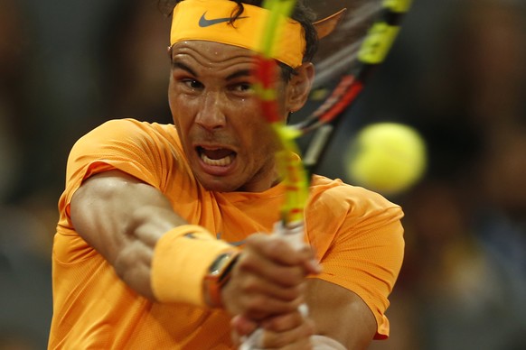 Rafael Nadal from Spain returns a ball from Diego Schwartzman from Argentina during a Madrid Open tennis tournament match in Madrid, Spain, Thursday, May 10, 2018. Nadal won 6-3, 6-4. (AP Photo/Franci ...