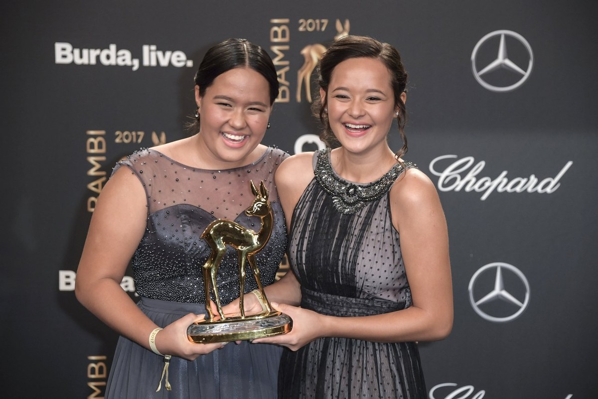 epa06333875 Balinese sisters and activists Melati and Isabel Wijsen pose with their 'Our World' award at the 69th annual Bambi awards ceremony in Berlin, Germany, 16 November 2017. The award ...