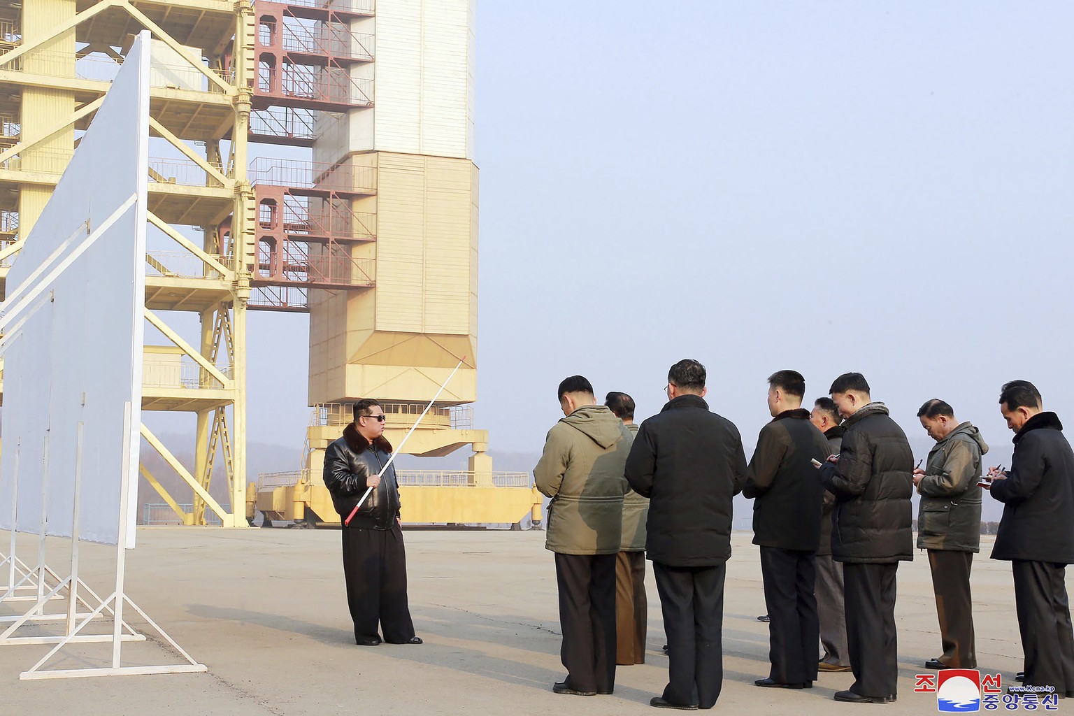 In this undated photo provided by the North Korean government on Friday, March 11, 2022, North Korean leader Kim Jong Un, left, visits the Sohae Satellite Launching Ground in Tongchang-ri, North Korea ...