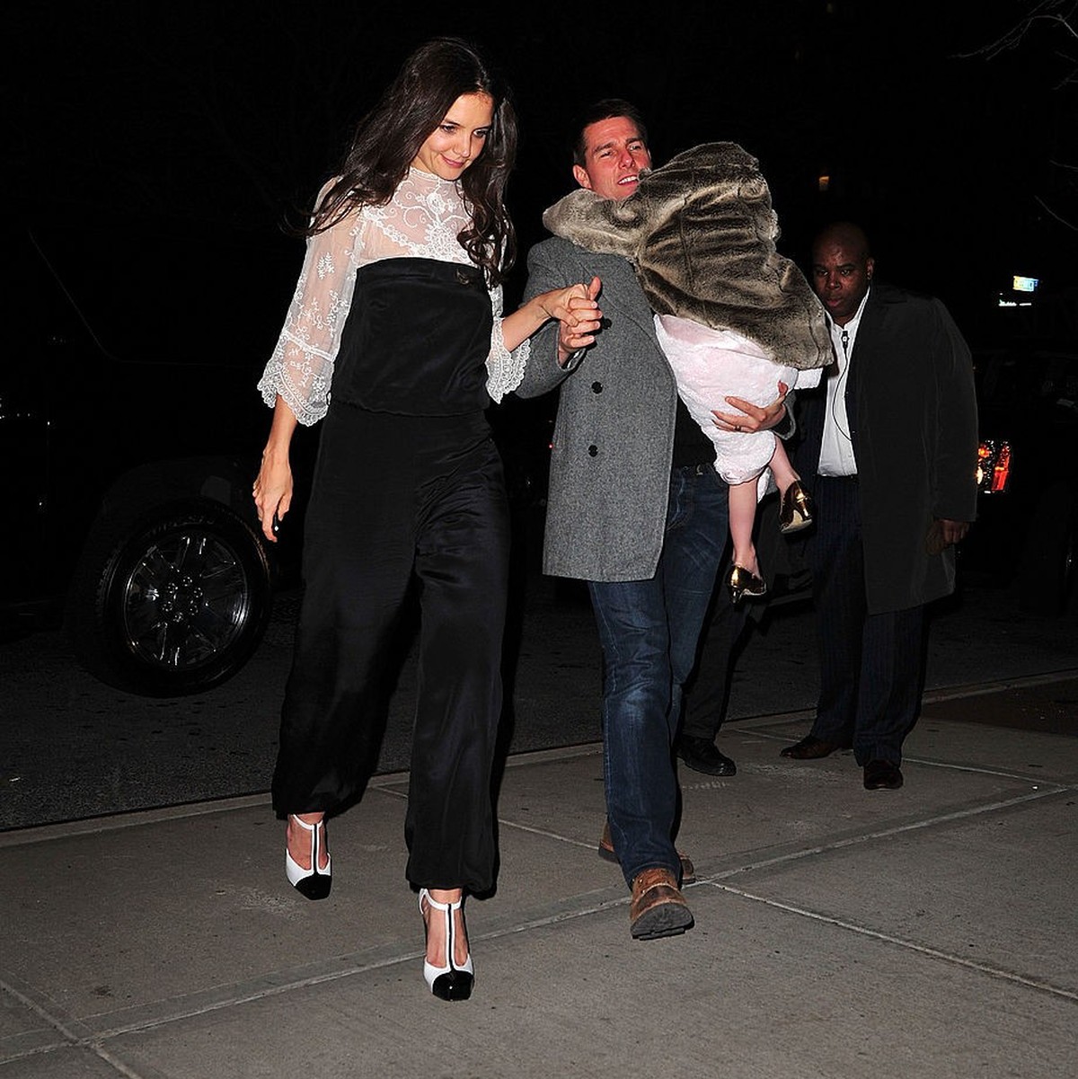 NEW YORK, NY - DECEMBER 18: Katie Holmes, Tom Cruise and Suri Cruise seen on the streets of Manhattan after celebrating Katie's birthday at Buddakan on December 18, 2011 in New York City. (Photo  ...