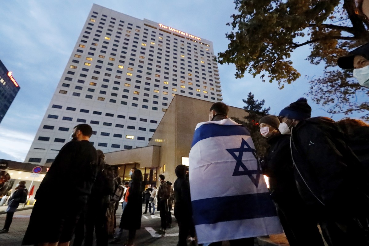 People gather in front of the "Westin Hotel" in Leipzig, Germany, Tuesday, Oct. 5, 2021 to show solidarity with the musician Gil Ofarim. A leading Jewish group in Germany says it's shoc ...