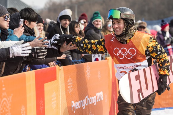 Nicolas Huber of Switzerland reacts in finish area during the qualification runs of the men&#039;s snowboard slopestyle competition in the Phoenix Snow Park during the XXIII Winter Olympics 2018 in Py ...