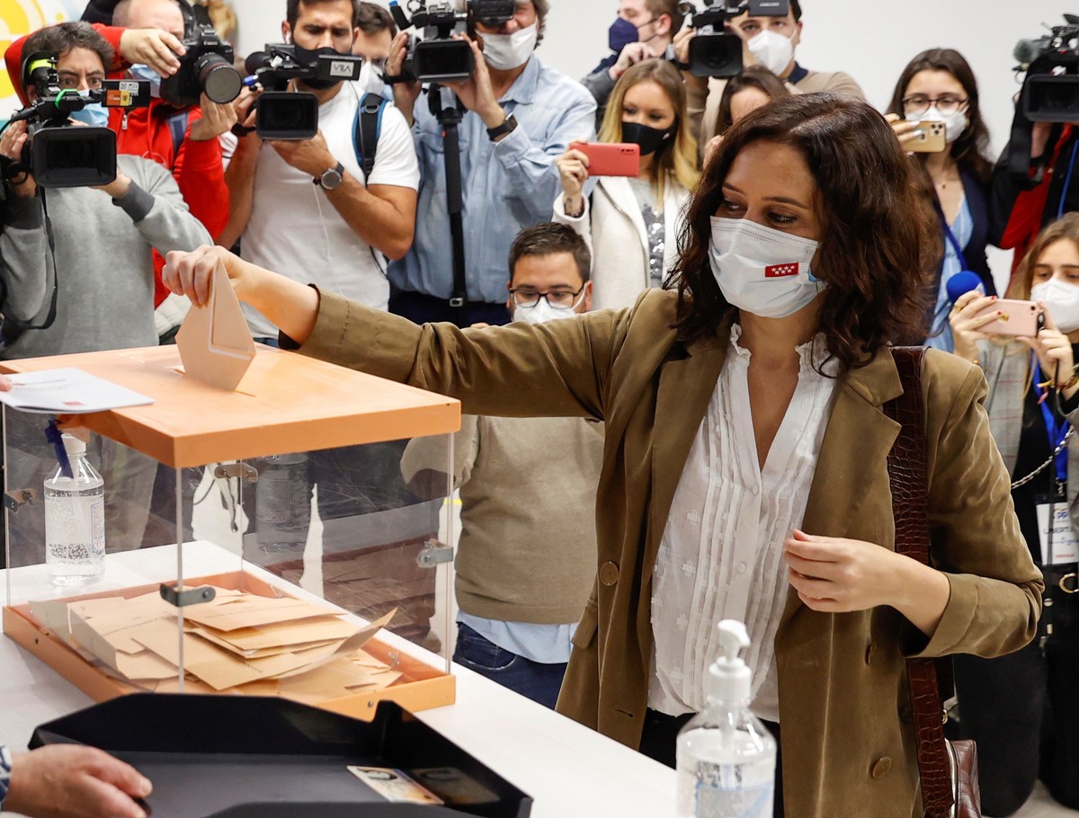 epa09176727 Isabel Diaz Ayuso, Madrid's Regional President and People's Party candidate for re-election, casts her ballot for Madrid's regional election at a polling station in downtown ...