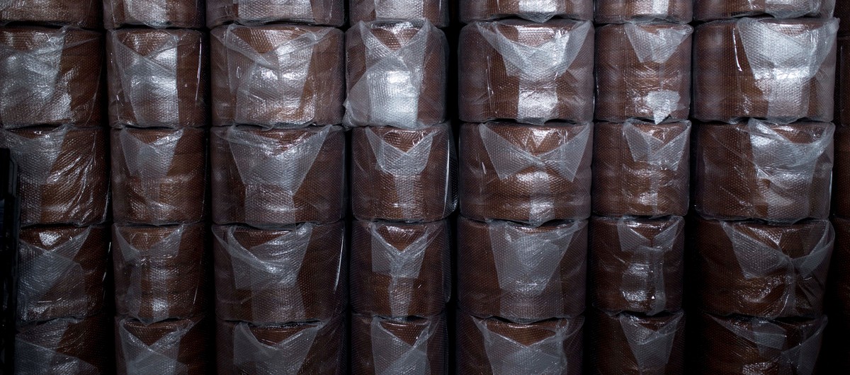 epa08347757 Several piled-up coffins are ready to be transported at Ataudes Galicia workshop in the village of Pinor, in Ourense, northwestern Spain, 07 April 2020. Coffin makers are overcome by the h ...