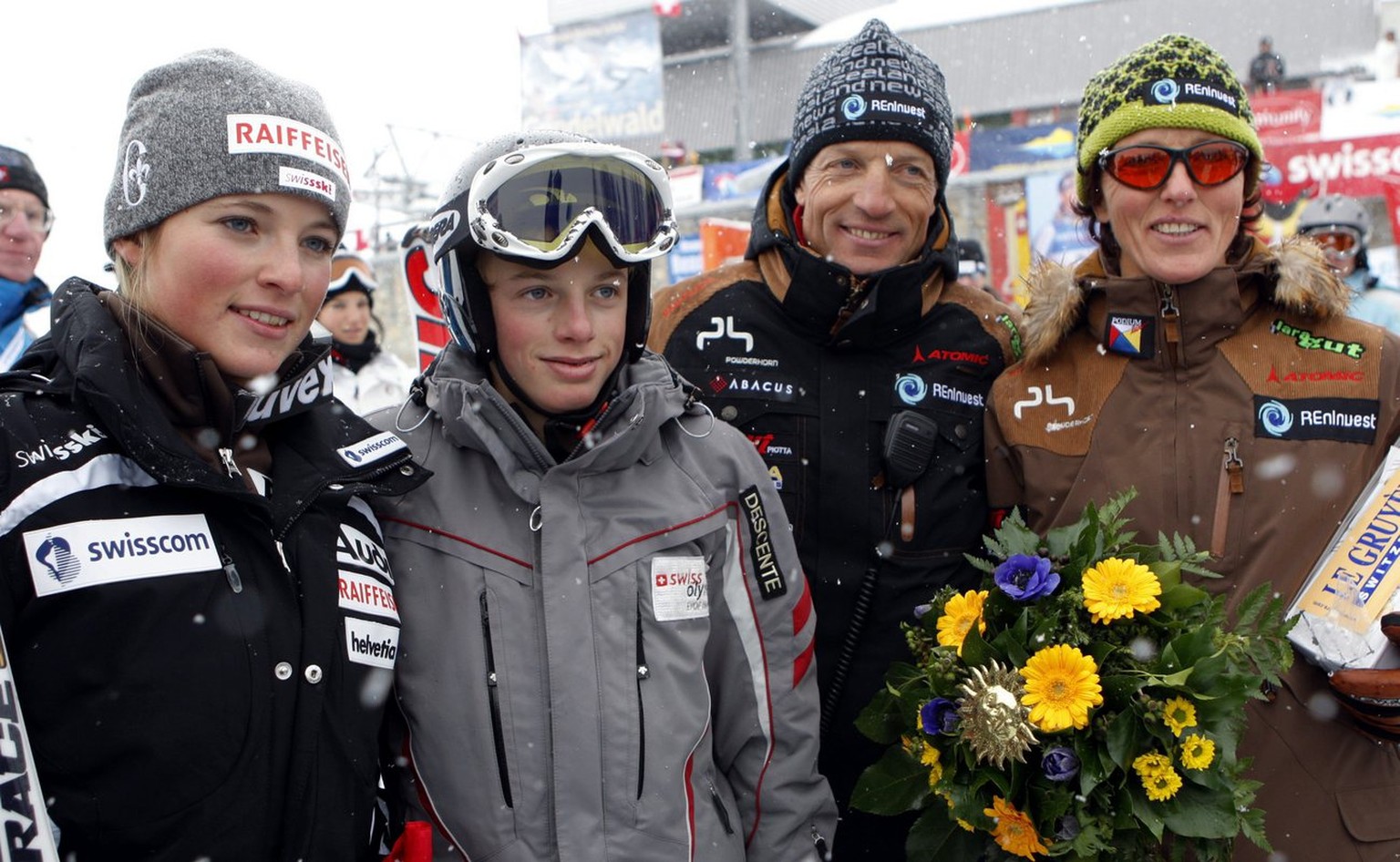 Switzerland&#039;s Lara Gut, celebrates her victory together with her brother Iann, her father Pauli and her mother Gabriella, from left, after the Womens Ski Alpine World Cup Super G race in St. Mori ...