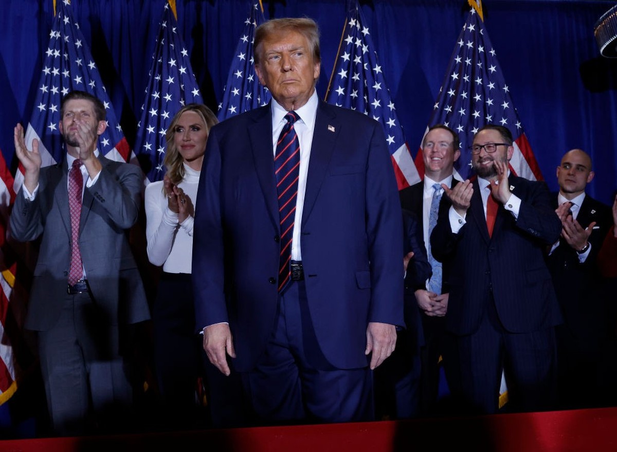 NASHUA, NEW HAMPSHIRE - JANUARY 23: Republican presidential candidate and former U.S. President Donald Trump takes the stage with supporters, campaign staff and family members for a primary night part ...