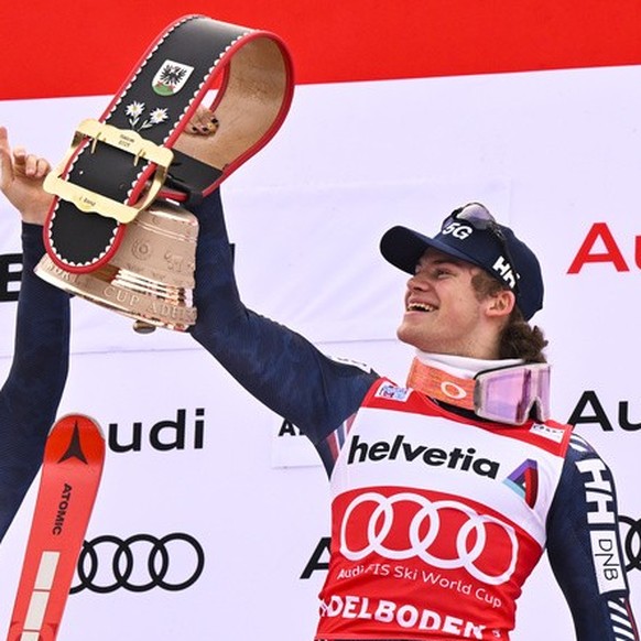 Second placed Atle Lie McGrath of Norway, winner Lucas Braathen of Norway, and third placed Linus Strasser of Germany, from left, react on the podium after the second run of the men&#039;s slalom race ...