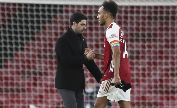 epa08882817 Pierre-Emerick Aubameyang (R) of Arsenal and Head coach Mikel Arteta (L) of Arsenal react after the English Premier League soccer match between Arsenal FC and Burnley FC in London, Britain ...