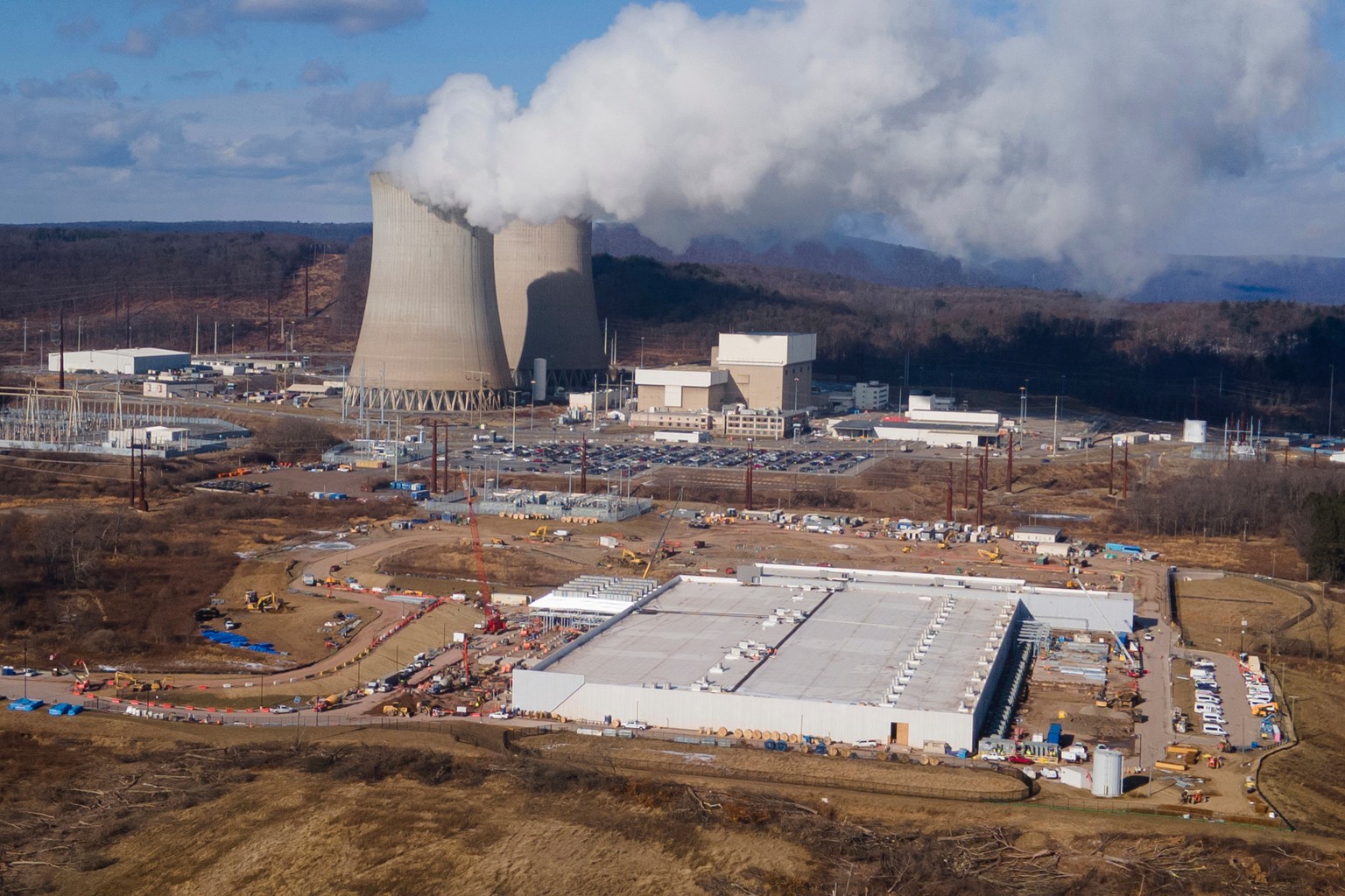 FILE - A data center owned by Amazon Web Services, front right, is under construction next to the Susquehanna nuclear power plant in Berwick, Pa., Jan. 14, 2025. (AP Photo/Ted Shaffrey, File)
Energy P ...