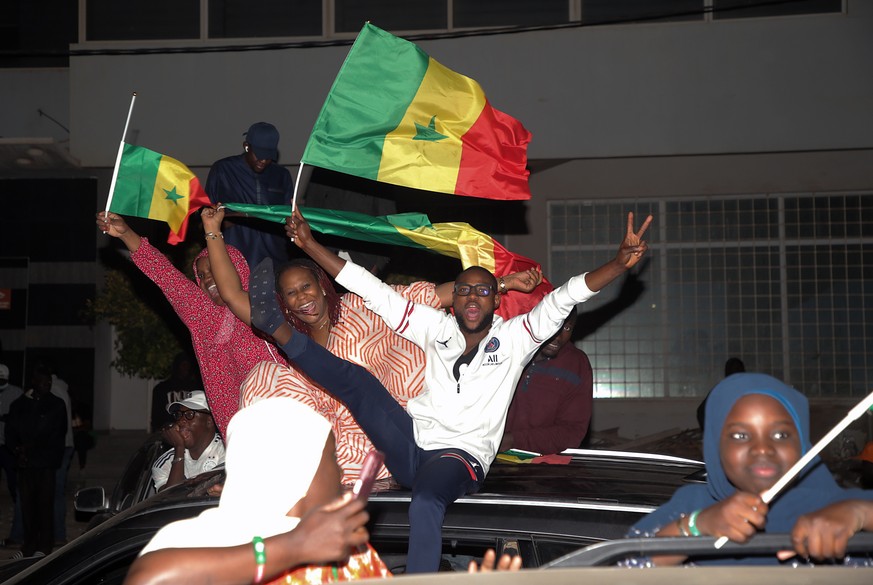 epaselect epa11242192 Supporters of opposition candidate Bassirou Diomaye Faye attend a rally as the results of the presidential elections are tallied, in Dakar, Senegal, 24 March 2024. Faye has emerg ...