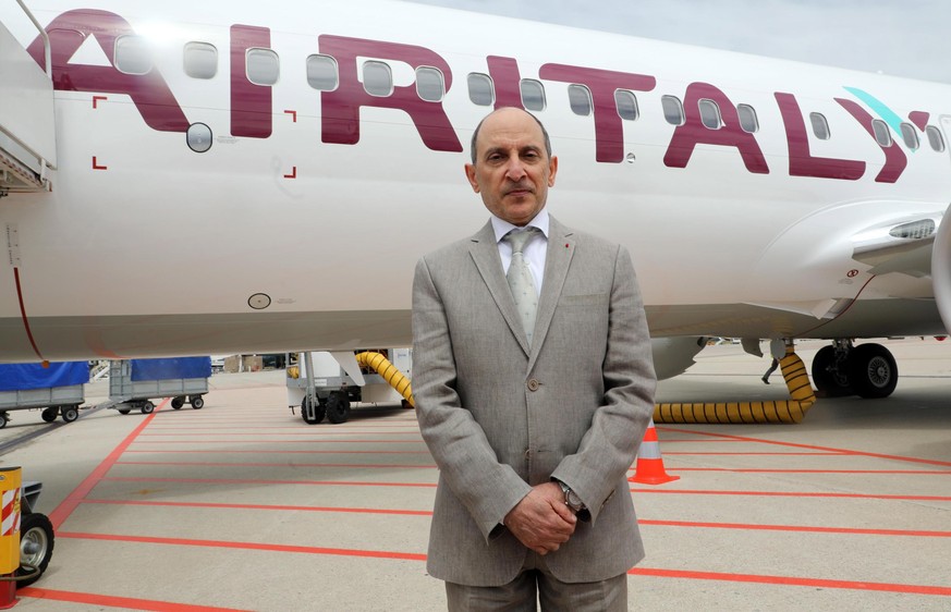 epa06735661 Ceo of Qatar Airways, Akbar Al Baker, poses next to the plane on the occasion of the presentation of the Boeing 737 max of Air Italy at Malpensa airport, near Varese, Italy, 14 May 2018. A ...