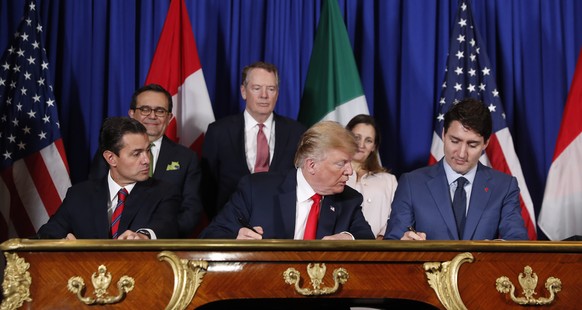 President Donald Trump, Canada&#039;s Prime Minister Justin Trudeau, right, and Mexico&#039;s President Enrique Pena Neto, left, participate in the USMCA signing ceremony, Friday, Nov. 30, 2018 in Bue ...