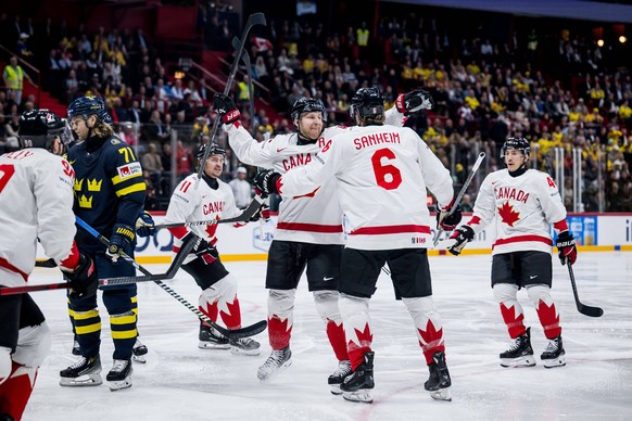 250520 Nathan MacKinnon and Travis Sanheim of Canada celebrate after 0-1 during the 2025 IIHF Ice hockey, Eishockey World Championship, WM, Weltmeisterschaft group stage game between Sweden and Canada ...