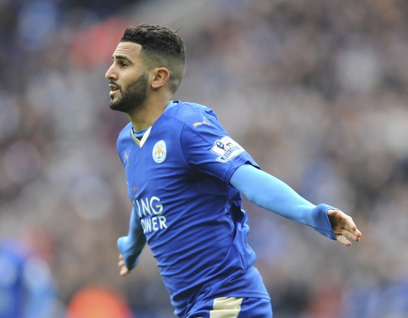 FILE- In this Sunday, April 24, 2016 file photo, Leicester&#039;s Riyad Mahrez celebrates after scoring during the English Premier League soccer match between Leicester City and Swansea City at the Ki ...