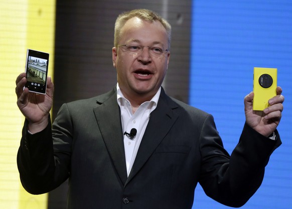FILE - In this July 11, 2013 file photo, then Nokia CEO Stephen Elop shows the company&#039;s Nokia Lumia 1020, in New York. Elop, now Microsoft Executive Vice President, sent employees of the company ...