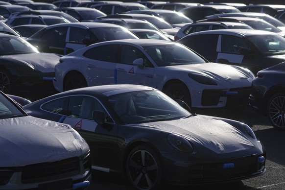 epa12909843 Cars for export wait for shipment at the port in Emden, Germany, 23 April 2026. Autoport Emden is the third-largest automobile handling port in Europe, with an annual handling volume of ar ...