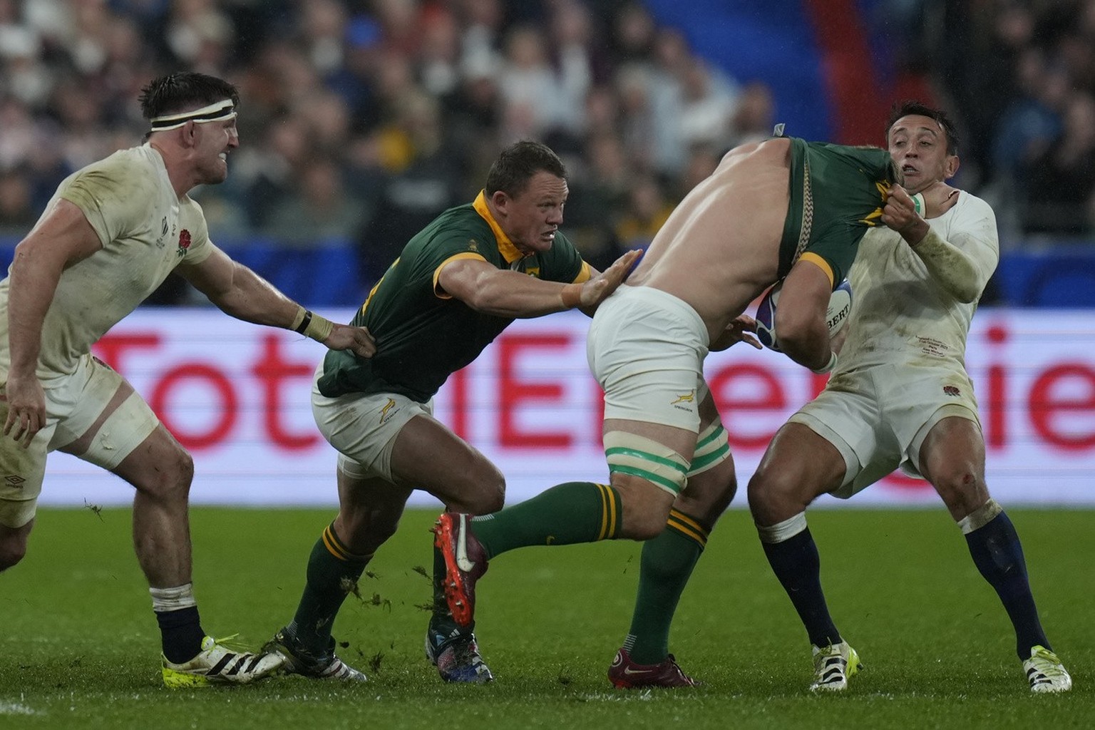 South Africa's Kwagga Smith, second right, advances with the ball during the Rugby World Cup semifinal match between England and South Africa at the Stade de France in Saint-Denis, outside Paris, ...