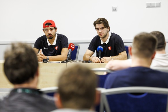 Switzerland&#039;s defender Jonas Siegenthaler, left, and Switzerland&#039;s forward Nico Hischier, right, talk to the media during a press conference after arriving in Riga for take part to the IIHF  ...