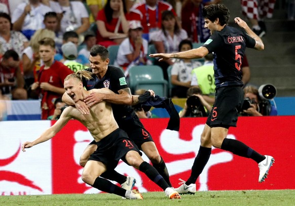 epa06872662 Domagoj Vida of Croatia (L), Dejan Lovren of Croatia (C) and Vedran Corluka of Croatia celebrate the 2-1 goal during the FIFA World Cup 2018 quarter final soccer match between Russia and C ...