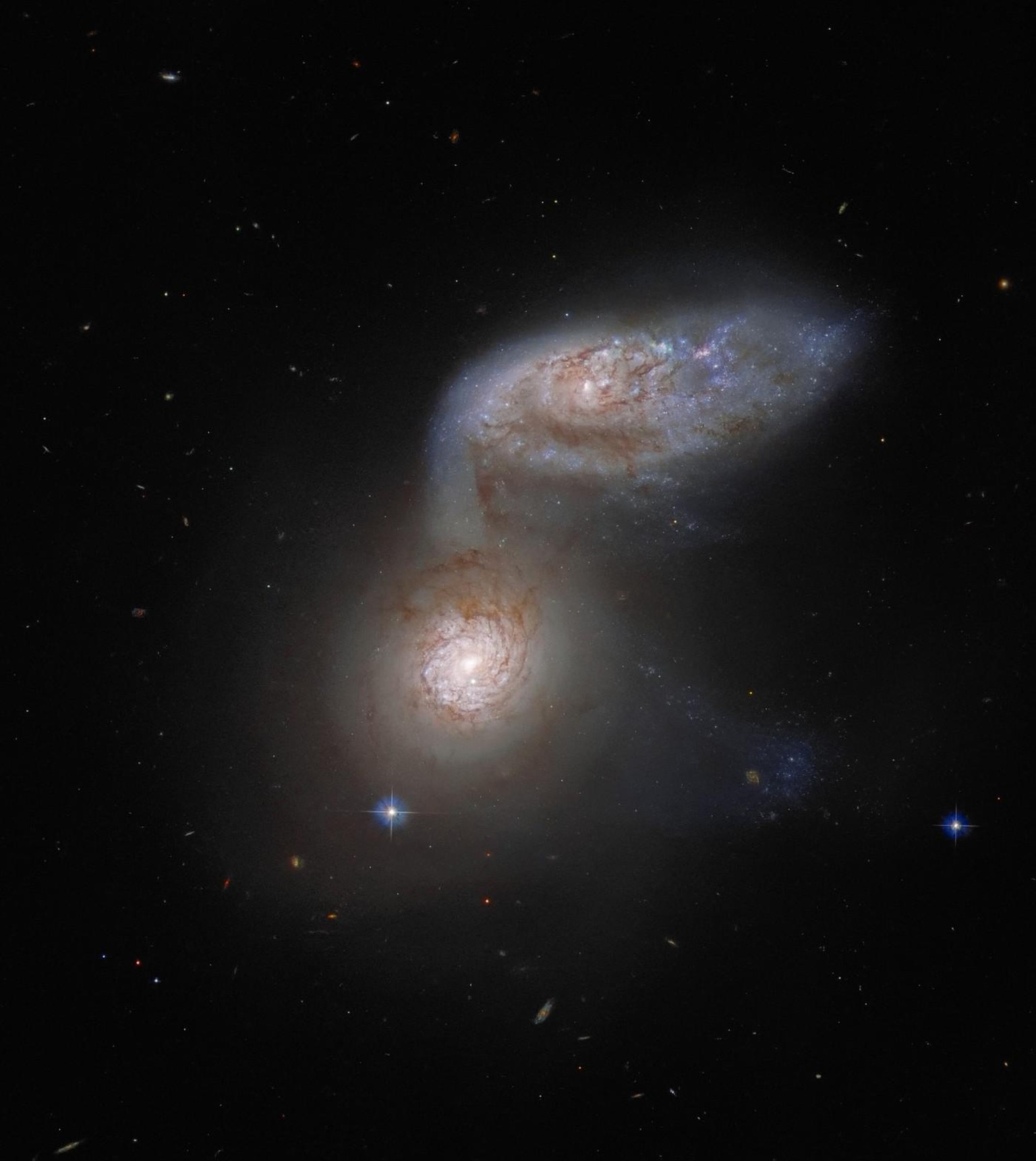 This Picture of the Week features two interacting galaxies that are so intertwined, they have a collective name — Arp 91. This delicate galactic dance is taking place over 100 million light-years from ...