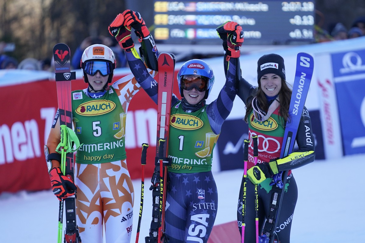 From left, second placed Slovakia's Petra Vlhova, the winner United States' Mikaela Shiffrin and third placed Italy's Marta Bassino celebrate after completing an alpine ski, women' ...