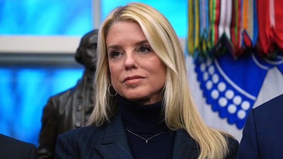 FILE - Attorney General Pam Bondi listens as President Donald Trump speaks at an event on addiction recovery in the Oval Office of the White House, Jan. 29, 2026, in Washington. (AP Photo/Allison Robb ...