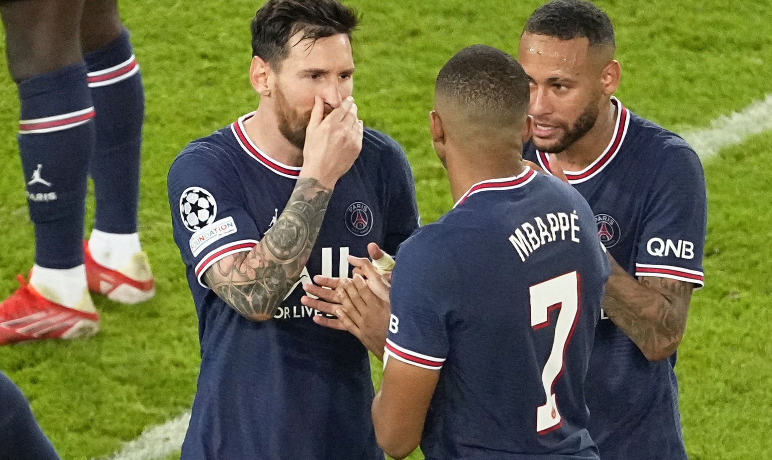 PSG&#039;s Lionel Messi, left, Kylian Mbappe, and Neymar, right, react following their win in their Champions League Group A soccer match against Manchester City at the Parc des Princes in Paris, Tues ...