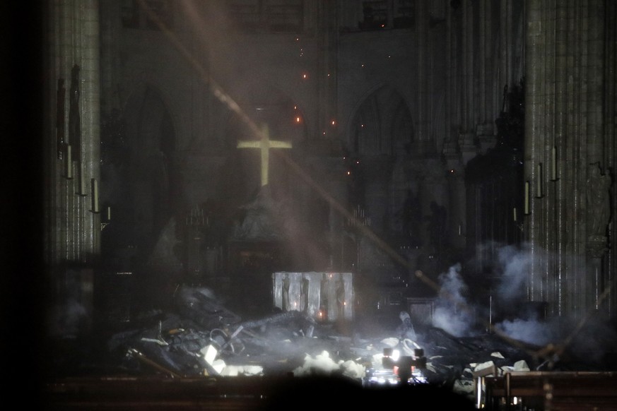 epa07509133 General view of the interior of the Notre-Dame Cathedral as flames are burning the roof cathedral in Paris, France, late 15 April 2019. A fire started in the late afternoon in one of the m ...