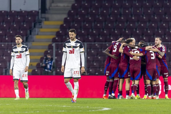 Uran Bislimi (LUG), left, and Anto Grgic (LUG), 2nd left, react after receiving their second goal, during the Super League soccer match of Swiss Championship between Servette FC, SFC, and FC Lugano, L ...
