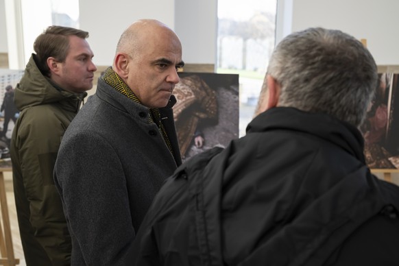 Alain Berset, President of the Swiss Confederation, center, listens to Andriy Kostin, General Prosecutor, right, next to Ruslan Kravchenko, Mayor of Bucha, left, during a conversation on prosecution o ...