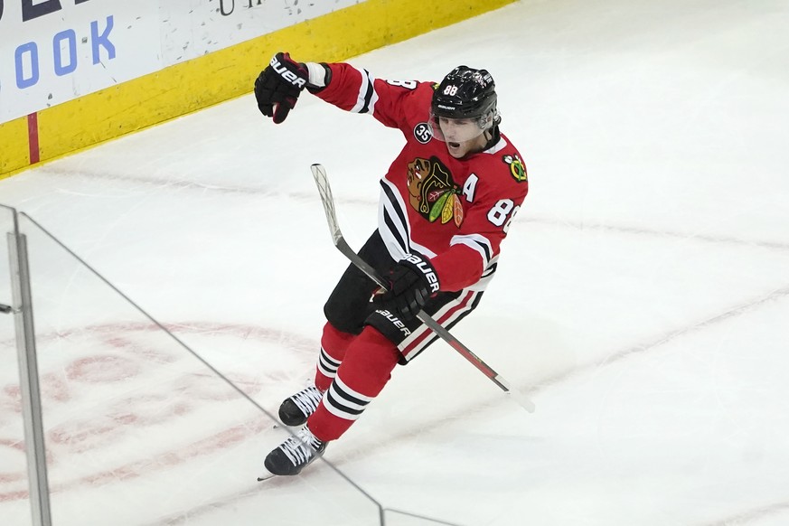 Chicago Blackhawks&#039; Patrick Kane celebrates his third goal against the New Jersey Devils, during the third period of an NHL hockey game Friday, Feb. 25, 2022, in Chicago. The Blackhawks won 8-5.  ...