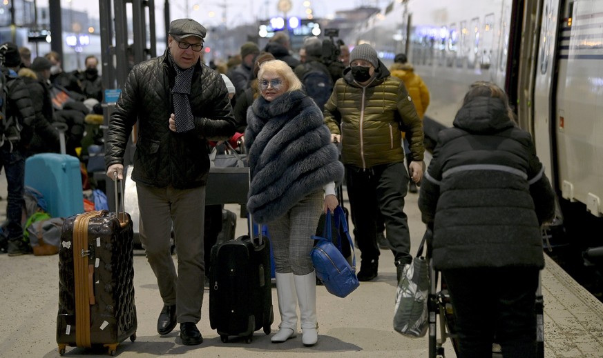 People get off the Allegro train that arrived in the evening from St. Petersburg, Russia, to the central railway station in Helsinki, Finland, Friday, March 4, 2022. Russia&#039;s war on Ukraine is no ...