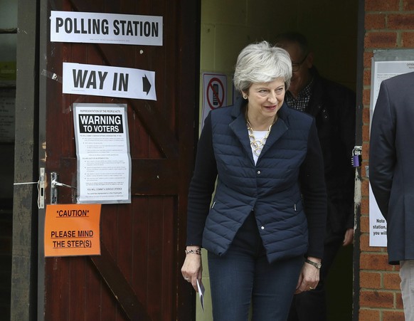 Britain&#039;s Prime Minister Theresa May leaves after casting her vote at a polling station near her home in the Thames Valley as voters headed to the polls for council and mayoral elections across E ...