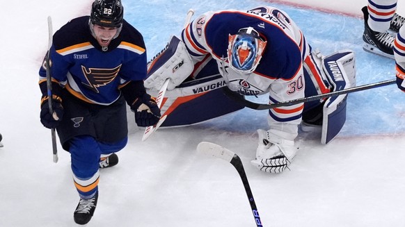 St. Louis Blues&#039; Pius Suter, left, celebrates after scoring the game-winning goal past Edmonton Oilers goaltender Calvin Pickard (30) during the third period of an NHL hockey game Monday, Nov. 3, ...