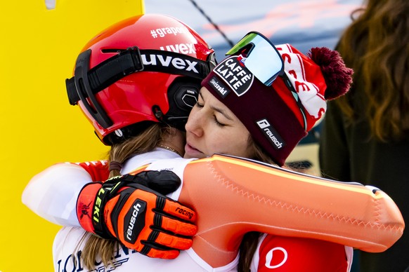 Lena Duerr of Germany reacts with Wendy Holdener of Switzerland, right, in the finish area during the Slalom race of the Women's Team Combined at the 2025 FIS Alpine World Ski Championships, in S ...
