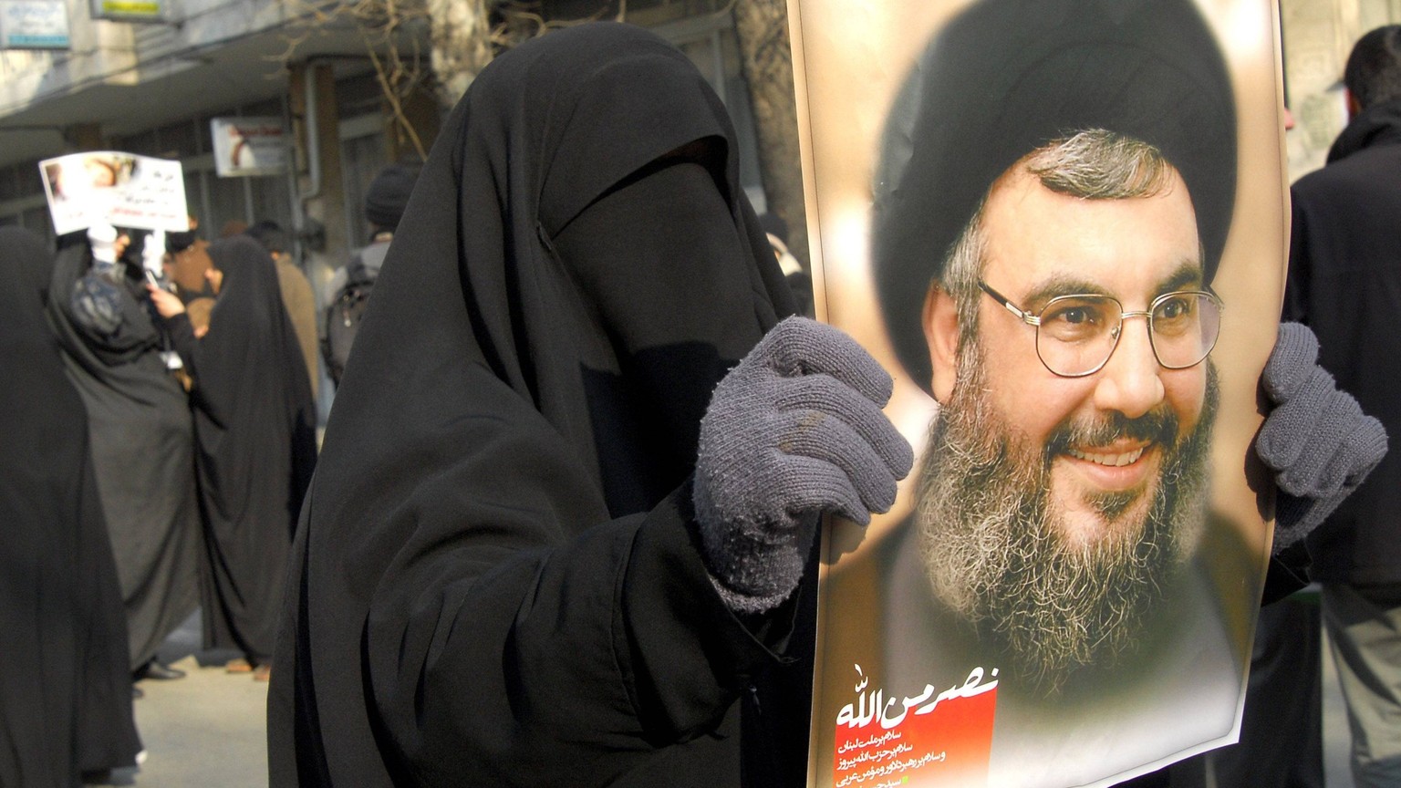 Jan 26, 2008 - Tehran, Iran - An Iranian female protestor holds up a picture of Lebanese Hezbollah leader Sheik Hassan Nasrallah, during an anti-Israel demonstration in support of Palestinians, in Teh ...