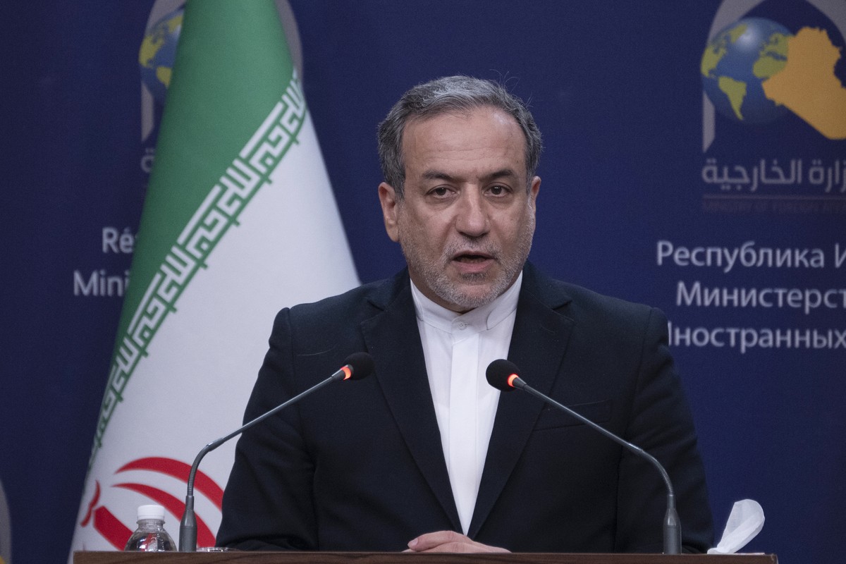 Iranian Foreign Minister Abbas Araghchi speaks during a news conference with his Iraqi counterpart Fouad Hussein, and Syrian Foreign Minister Bassam Sabbagh, following their meeting, in Baghdad, Iraq, ...