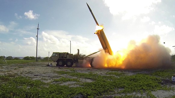 epa06249578 (FILE) - A handout file photo provided by the United States Department of Defense (DoD) shows a Terminal High Altitude Area Defense (THAAD) interceptor being launched from a THAAD battery site...