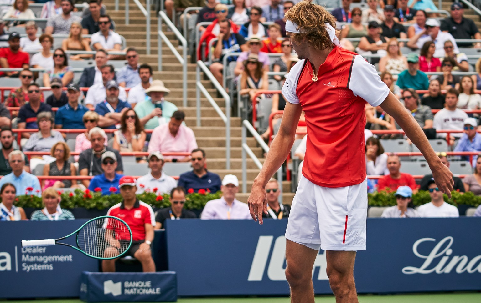 epaselect epa07765014 Alexander Zverev of Germany throws his tennis racket after he lost a set against Karen Khachanov of Russia during the Men&#039;s Singles quarter-final at the Rogers Cup tennis to ...