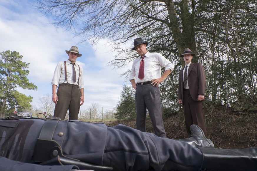 This image released by Netflix shows, from left, Woody Harrelson, Kevin Costner and Thomas Mann in a scene from &quot;The Highwaymen.&quot; (Merrick Morton/Netflix via AP)