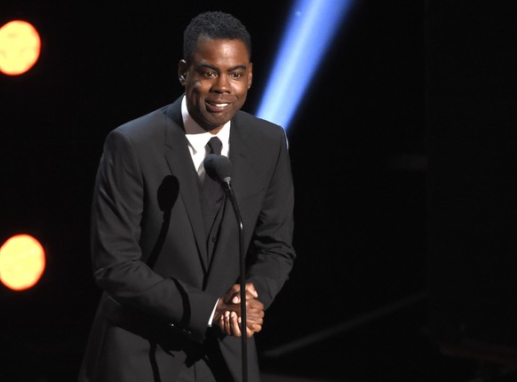 FILE - In this March 30, 2019 file photo, Chris Rock presents the award for outstanding comedy series at the 50th annual NAACP Image Awards at the Dolby Theatre in Los Angeles. Chris Rock on Sunday, S ...