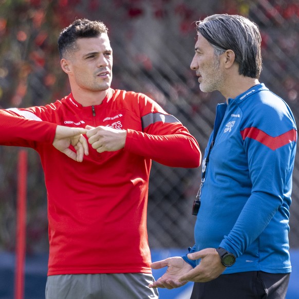 Coach Murat Yakin speaks with Granit Xhaka during a training session of the Switzerland national team for the European Qualifiers 2024 against Belarus on Sunday, St. Gallen, Switzerland, on Thursday,  ...