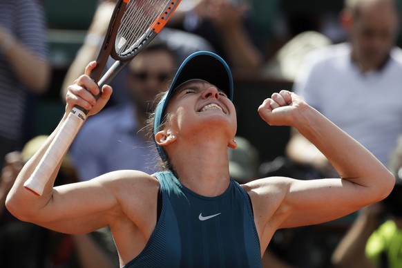 Romania&#039;s Simona Halep celebrates winning returns her semifinal match of the French Open tennis tournament against Spain&#039;s Garbine Muguruza in two sets, 6-1, 6-4, at the Roland Garros stadiu ...