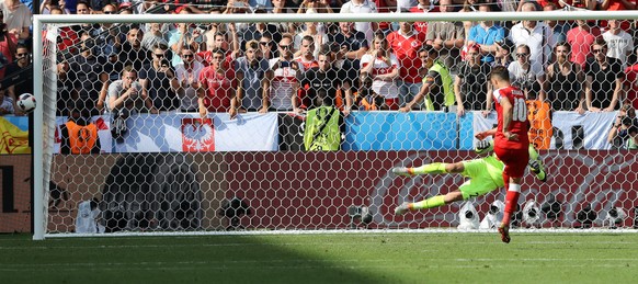 Switzerland's Granit Xhaka misses a penalty kick during the Euro 2016 round of 16 soccer match between Switzerland and Poland, at the Geoffroy Guichard stadium in Saint-Etienne, France, Saturday, ...