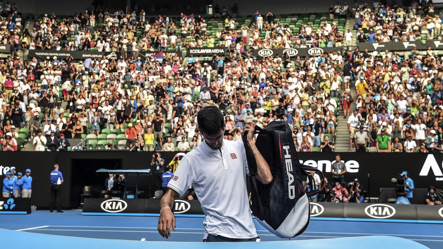 epa05729954 Novak Djokovic of Serbia leaves the court after losing against Denis Istomin of Uzbekistan during round two of the Mens Singles at the Australian Open Grand Slam tennis tournament in Melb ...
