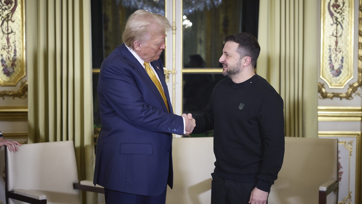 epa11763045 A handout picture made available by the Presidential Press Service of Ukraine shows US President-elect Donald Trump (L), and Ukrainian President Volodymyr Zelensky (R) shaking hands during ...